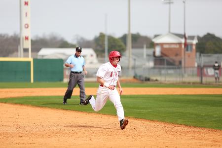 Caleb Warnimont runs to third base during a baseball game against Henderson State. - Photo by Kristi McMurry Woody