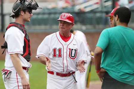 Lee Driggers, head baseball coach, talks to his players in between innings in a game against Henderson State. The Bulldogs won one game and lost one game of the double header. - Photo by Kristi McMurry Woody
