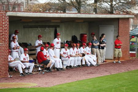The Bulldog baseball team watches as a player steps up to bat in the last inning of the first game against Henderson State. The Bulldogs won one game and lost one game of the double header. - Photo by Kristi McMurry Woody