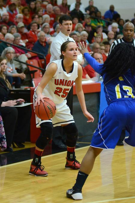 Amber Rechis, senior guard and exercise science major, looks for a pass in a tournament game in Fred Delay Gymnasium. - Photo by Meg Rushing