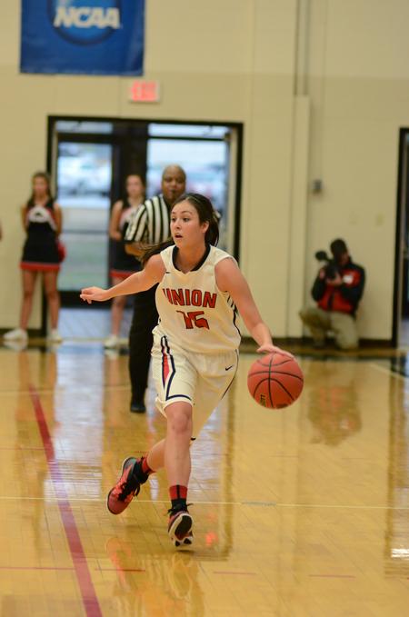 Chelsea Bodiford, junior guard and exercise science major, moves down the court in a tournament game. - Photo by Meg Rushing