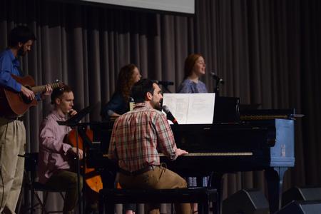 Cody Curtis, assistant residence director, leads worship in a chapel service along with other band members in the G.M. Savage Memorial Chapel. - Photo by Meg Rushing