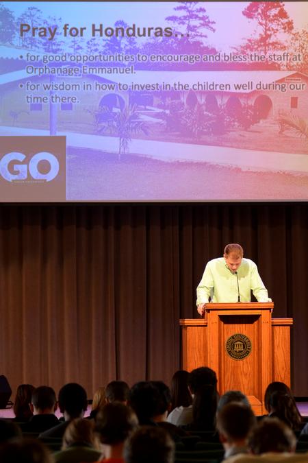 Blake Pennington, director of wellness services, leads a prayer for the GO trip to Honduras over spring break. - Photo by Meg Rushing