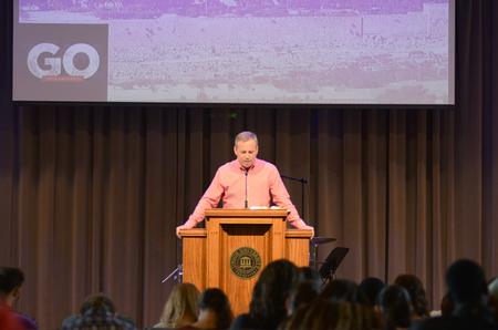 Dub Oliver, president of the university, prays over the students that will be going on GO Trip's this upcoming summer during the Go Trip Report chapel service. - Photo by MiKalla Cotton