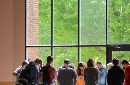Students serving this summer pray together during the GO Trip Report chapel. - Photo by MiKalla Cotton
