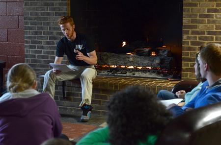 Jonny Wilson, senior athletic training major, shares a piece during the English portion of the Scholarship Symposium in the fireplace room of the Bowld Student Commons.  - Photo by MiKalla Cotton