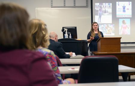 Emilie Malone, senior art studio major, presents her senior presentation during the art section of the Scholarship Symposium in the Penick Academic Complex. - Photo by MiKalla Cotton