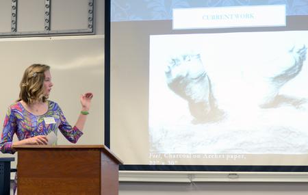 Ragan Pendley, sophomore art major, talks about her art during her presentation at the Scholarship Symposium. - Photo by MiKalla Cotton