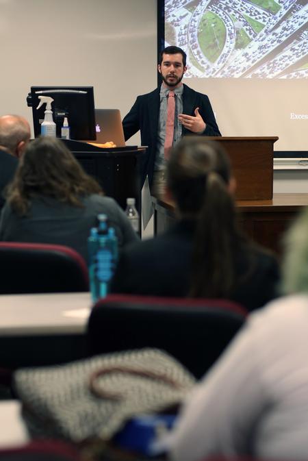 Zac Pankey, junior art major, gives a presentation on how furniture provides rest and relationships at the Twelfth Annual Scholarship Symposium. - Photo by Amanda Rohde