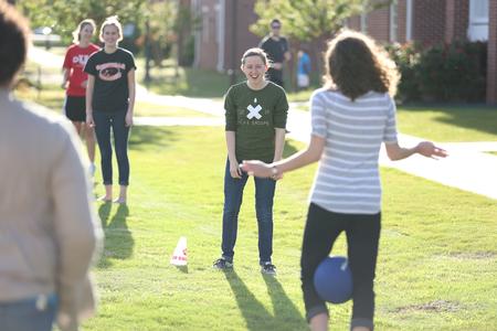Students participate in one of four relays at the Residence Life Field Day event. - Photo by Kristi McMurry Woody