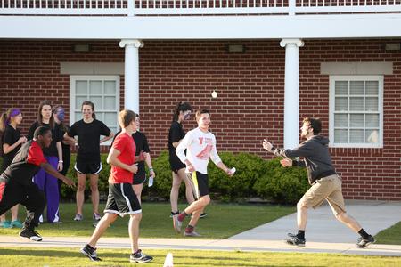 A team of students does a balloon toss relay during Residence LIfe's Field Day event.  - Photo by Kristi McMurry Woody