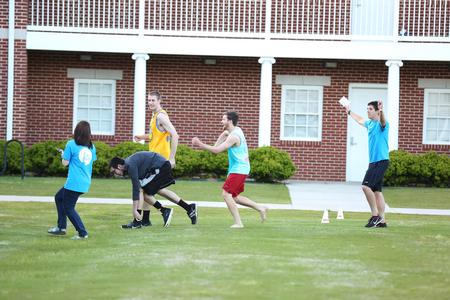 A team of students participate in a race as part of Field Day on the lawn outside the Bowld Student Commons.  - Photo by Kristi McMurry Woody