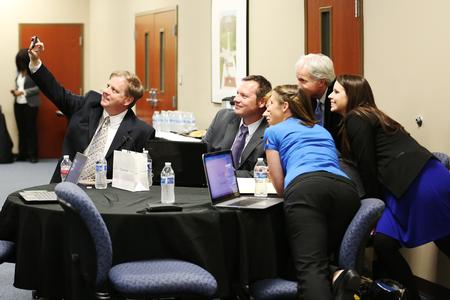 A group of students takes a photo at the end of their time in the MBA program. One of the benefits of this program is the relationships that students form with their cohort.  - Photo by Kristi McMurry Woody