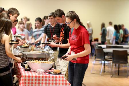 Students get their dinner during Summer Orientation. - Photo by Kristi McMurry Woody