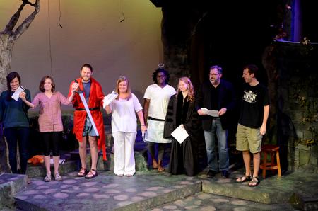 The History of the English Language class of Gavin Richardson, professor of english, takes a bow after a play performance for the Scholarship Symposium. - Photo by Meg Rushing