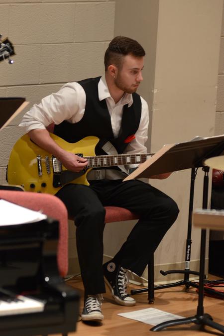 Caleb Smith, sophomore music major, plays guitar for the Union University Jazz Band in a concert in Hartley Hall. - Photo by Meg Rushing