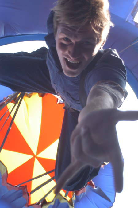 Senior Patrick Myers imitates Spiderman in the parachute drop during Union's Fall Fest. - Photo by Jonathan Blair