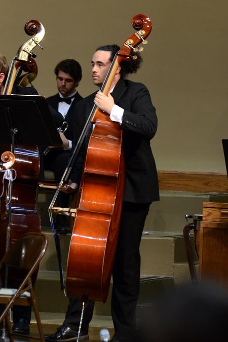 Reed McLean, junior computer science major, plays in the university orchestra concert at First Baptist Church in Jackson. - Photo by Meg Rushing