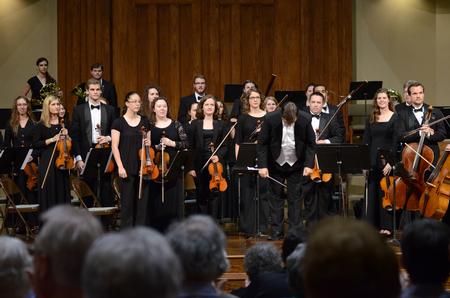 Michael Mann, assistant professor of music, takes a bow after directing the orchestra in performing a Mozart Overture in a concert at First Baptist Church in Jackson. - Photo by Meg Rushing