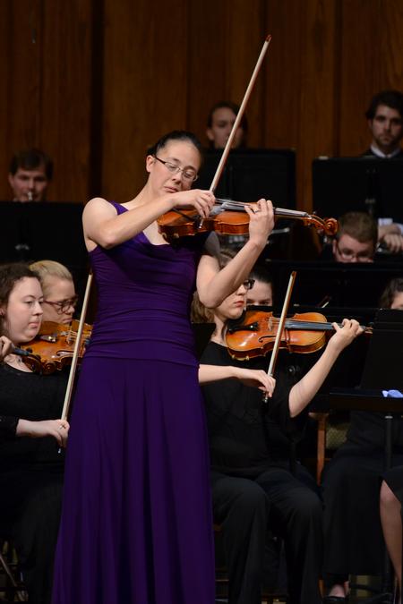 Paige Tang, senior music major, performs the Conus Violin Concerto in an orchestra concert. - Photo by Meg Rushing