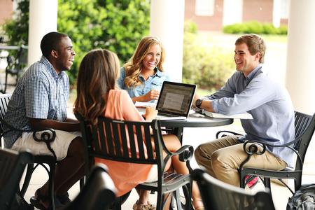 TreTharpe, Jana Ingram, Cassidy Sheppard and Austin Orr hang out on the patio of the Bowld Student Commons. - Photo by Kristi McMurry Woody