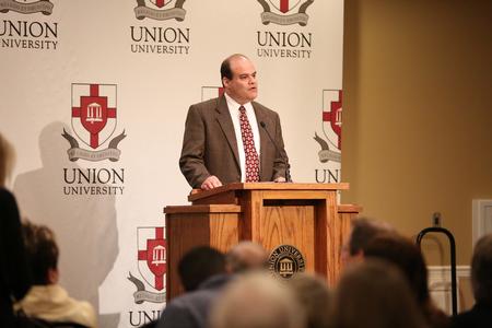 John Carbonell, associate vice president for human resources, welcomes guests to the annual reception for retiring faculty. - Photo by Kristi McMurry Woody
