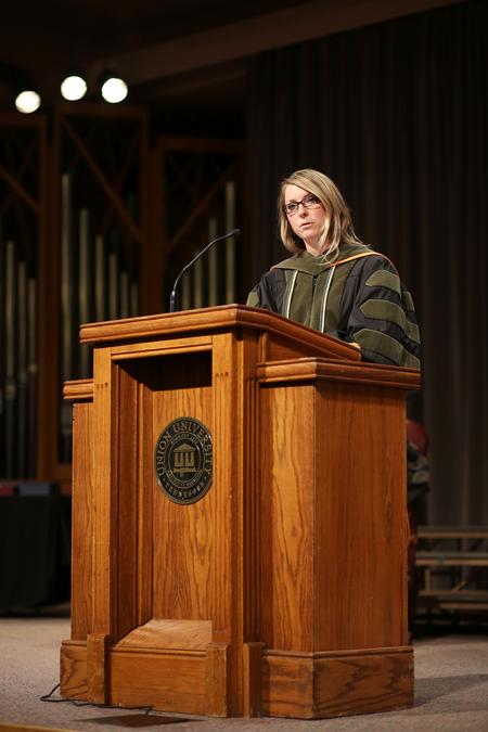 Kim Jones, associate professor of pharmacy practice, gives a charge to graduating pharmacy students during the 2015 Honors and Awards Ceremony. - Photo by Kristi McMurry Woody