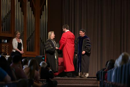 Kenneth Russell Davis receives the Pharmaceutical Sciences Award in Pharmaceutics during the 2015 Honors and Awards Ceremony for graduating doctor of pharmacy students. - Photo by Kristi McMurry Woody