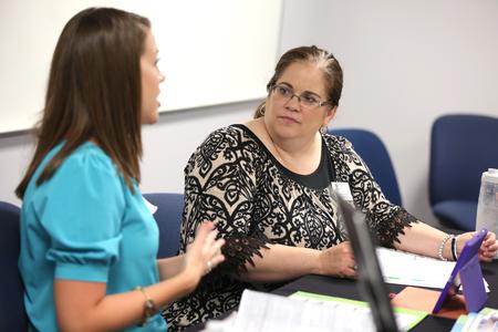 Nancy Cherry, professor of education and director of M.A.Ed., hears a presentation from a master of education candidate. - Photo by Kristi McMurry Woody