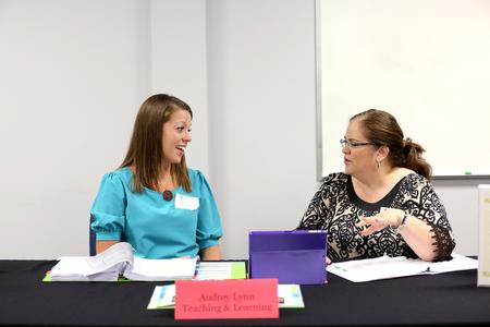 Audrey Lynn, master of education graduate, gives her final presentation to Nancy Cherry, professor of education and director of M.A.Ed.. - Photo by Kristi McMurry Woody