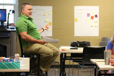 Chris Hail, professor of mathematics, speaks to a group of area math teachers at a Math Institute hosted by the School of Education. - Photo by Kristi McMurry Woody