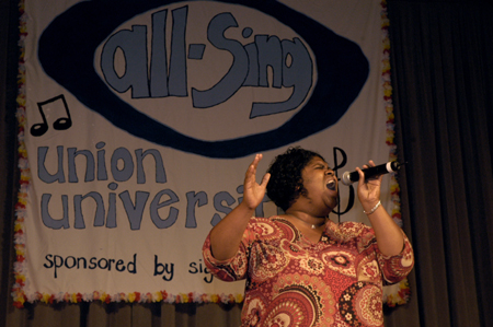 Enrollment counselor Crystal Taylor performed as a filler during the small-group portion of the 2004 All-Sing competition. - Photo by Kathleen Murray