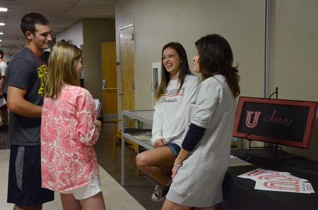 New students talk to Sydney Fly, junior Christian ministry and missions major, and Susie Oliver, cheerleading coach, at the Student Organization Fair. - Photo by MiKalla Cotton