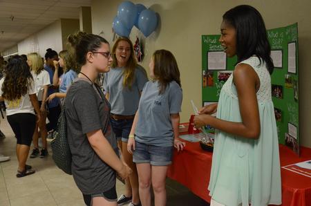 H.J., senior business administration major and Student Government Association president, talks to a new student about SGA during the Student Organization Fair. - Photo by MiKalla Cotton