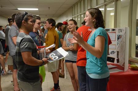 Sarah Troxel, junior intercultural studies major, talks to new students about the International Justice Mission at the Student Organization Fair. - Photo by MiKalla Cotton