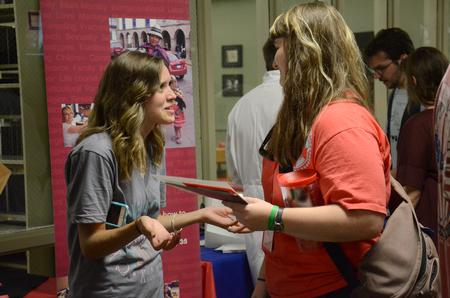 Kristi Hardester, junior psychology major, talks to a new student during the Student Organization Fair of Welcome Week. - Photo by MiKalla Cotton