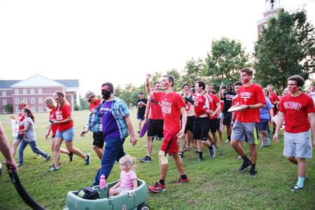 Students march over to the soccer field after painting faces and getting ready to cheer on the bulldogs. - Photo by Kristi McMurry Woody
