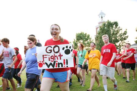 Students march over to the soccer field ready to cheer on the Bulldogs in their home opener. - Photo by Kristi McMurry Woody