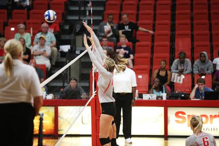 Casi Neff and Christa Karns go up for a block against the Lane College Lady Dragons. - Photo by Kristi McMurry Woody