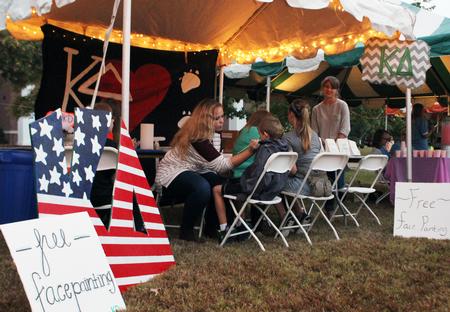 Kappa Delta sisters provide free face painting during Family Weekend's Union Night on the Great Lawn. - Photo by Sol Bee Park