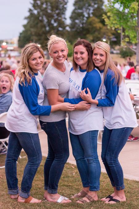 Chi Omega sisters pose for a photo near the end of their successful Make-A-Wish Barbecue.  - Photo by David Parks