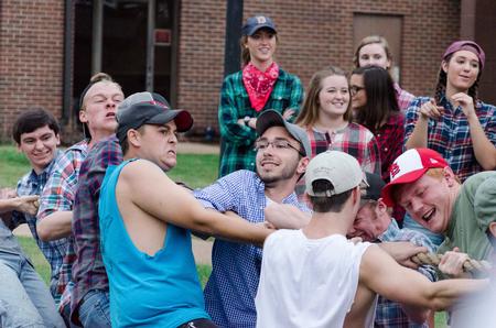 Residents of Dodd pull their hardest in tug-of-war during the DF Olympics on the Heritage Complex Lawn. - Photo by David Parks