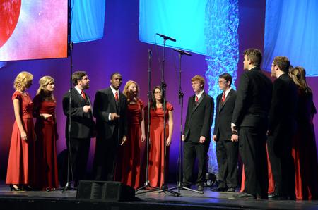 At the Carl Perkins Civic Center, the Proclamation ensemble sings to the audience for the Scholarship Banquet before David Brooks takes the stage. - Photo by Elizabeth Wilson
