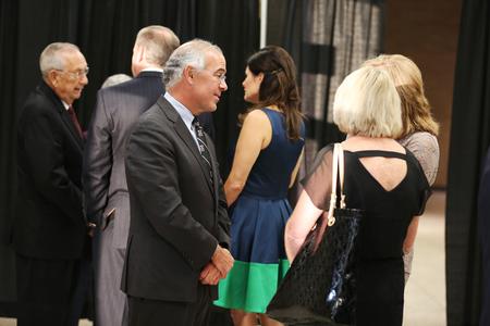 New York Times columnist and author David Brooks chats with guests of the 18th annual Scholarship Banquet prior to speaking. - Photo by Kristi McMurry Woody