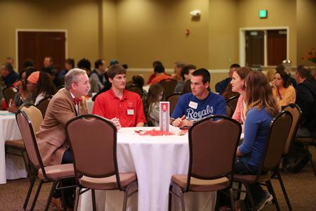 Dub Oliver, president of the university, and Georg Pingen, associate professor of engineering, chat with a prospective student and his family during a Bulldog Day. - Photo by Kristi McMurry Woody