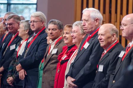 Members of the class of 1966 stand as they are recognized during the homecoming chapel. - Photo by David Parks