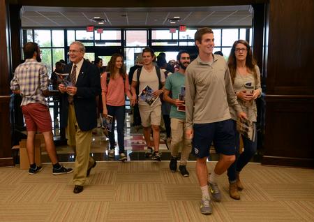 People flood The Logos once the doors are opened at the grand opening. - Photo by MiKalla Cotton