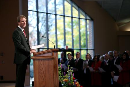 Chris Mathews, professor of music and department chair, leads the congregation in a hymn during Homecoming chapel. - Photo by Kristi McMurry Woody