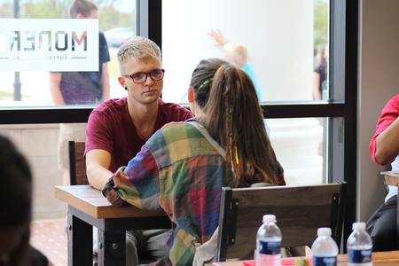 Chris Carlton, junior psychology major, and Natalie Gandy, junior art major, enjoy their time at Modero, the new cafe at The Logos. - Photo by Sol Bee Park