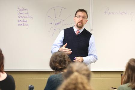 Justin Barnard, associate professor of philosophy, teaches a class in the Bowld Student Commons.  - Photo by Kristi McMurry Woody